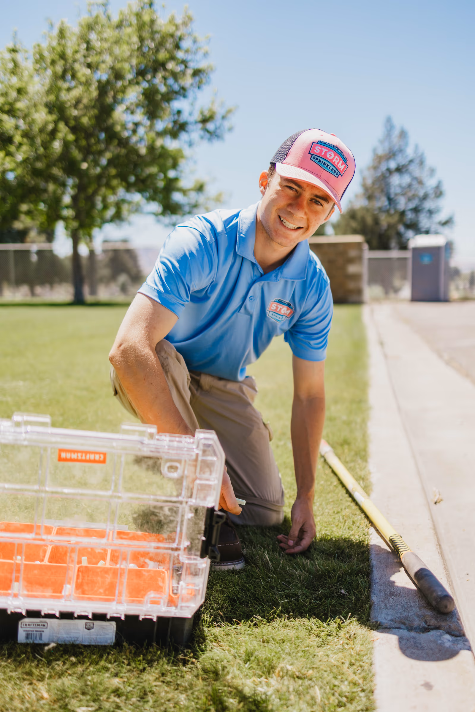 Storm Sprinklers technician discussing a sprinkler system maintenance estimate with a homeowner