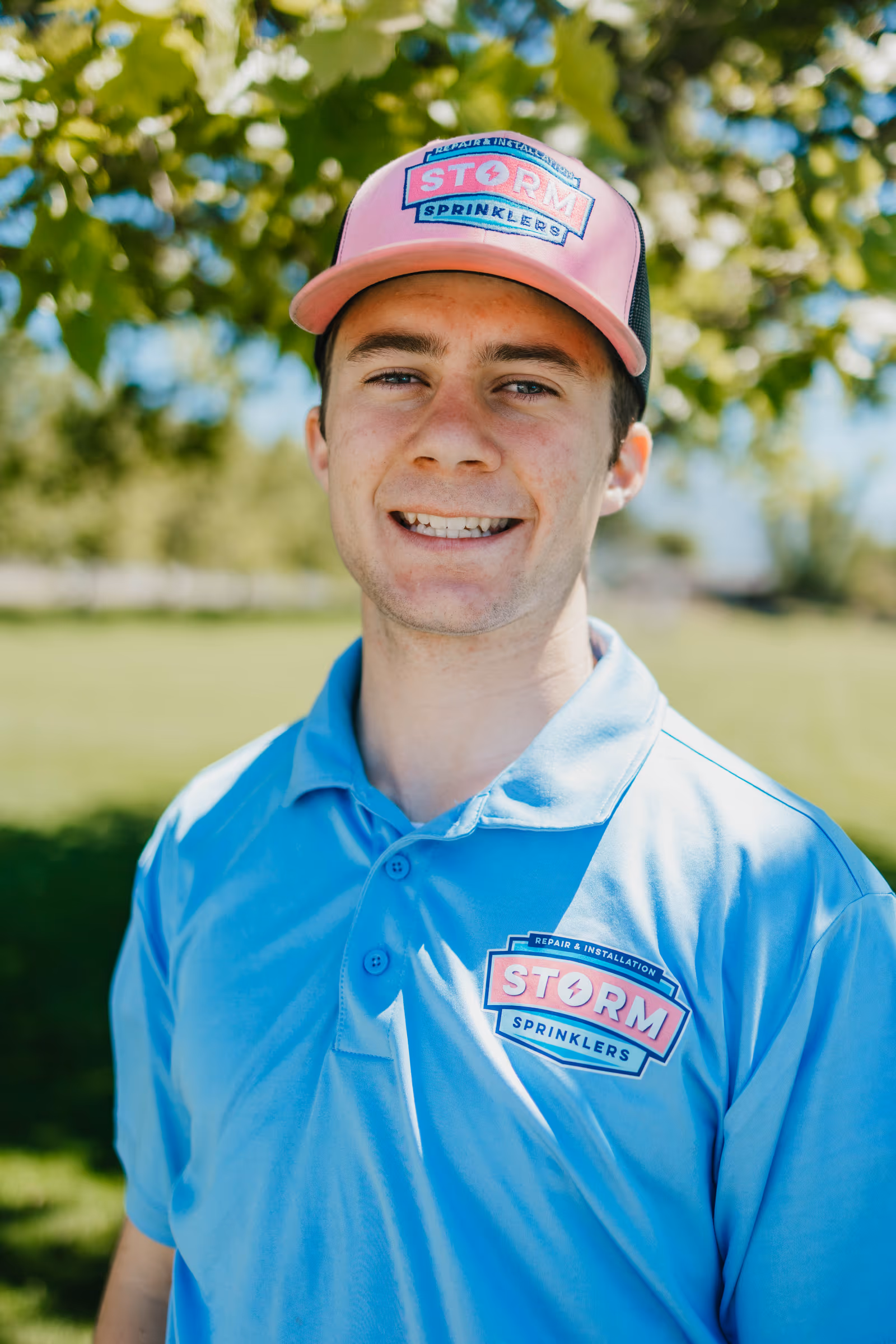 Smiling Storm Sprinklers technician ready to book your summer sprinkler tune-up