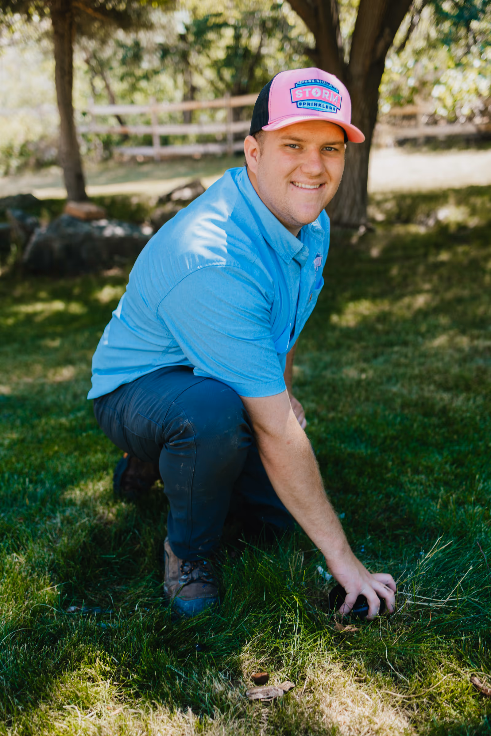 Two Storm Sprinklers technicians working together to service an in-ground sprinkler system