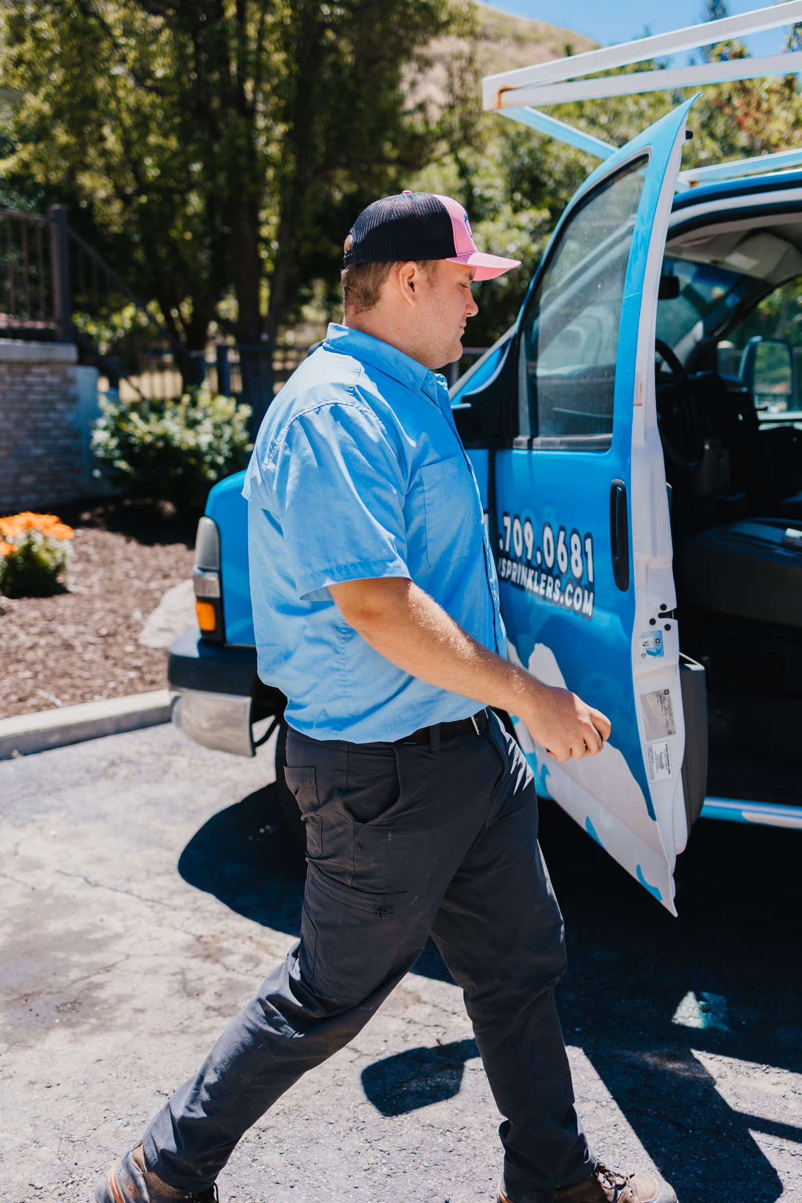 Storm Sprinklers commercial technician arriving from a branded service van